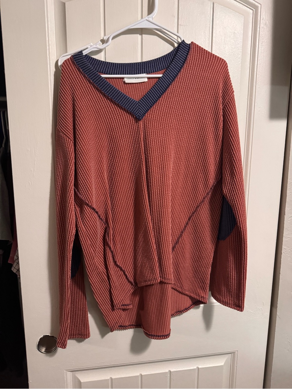 Rusted Orange Ribbed V-Neck Sweater with Navy Trim